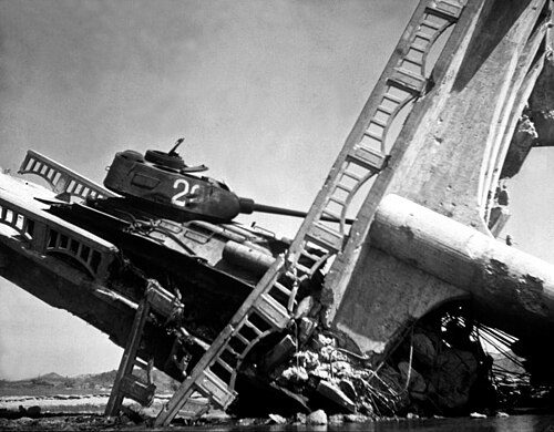 North Korean T-34-85 caught on a bridge south of Suwon by US attack aircraft in the Korean War